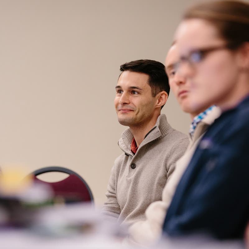 Grad student smiling in class