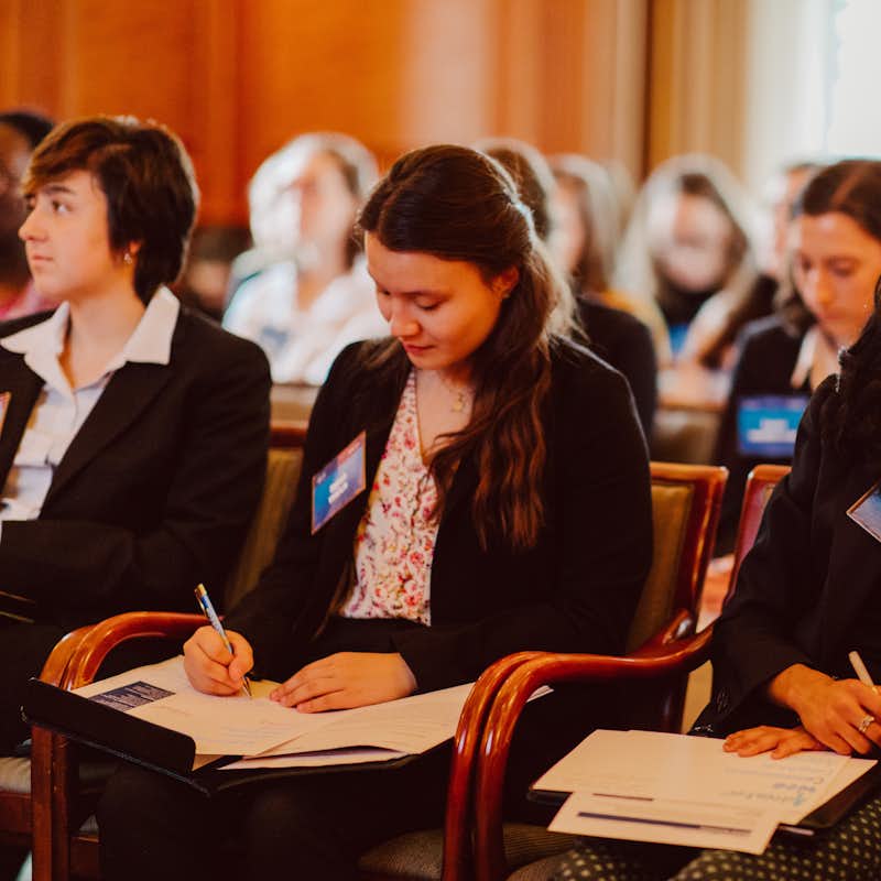 Students listen to a lecture at a career networking event