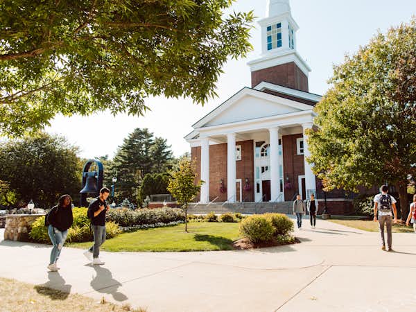 Students walk in front of the chapel courtyard
