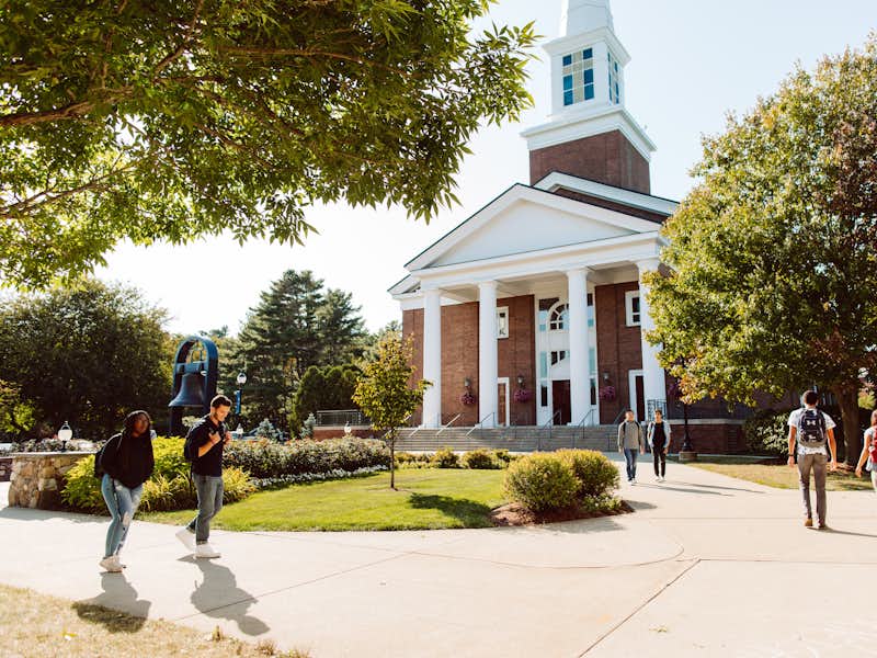 Students walk in front of the chapel courtyard
