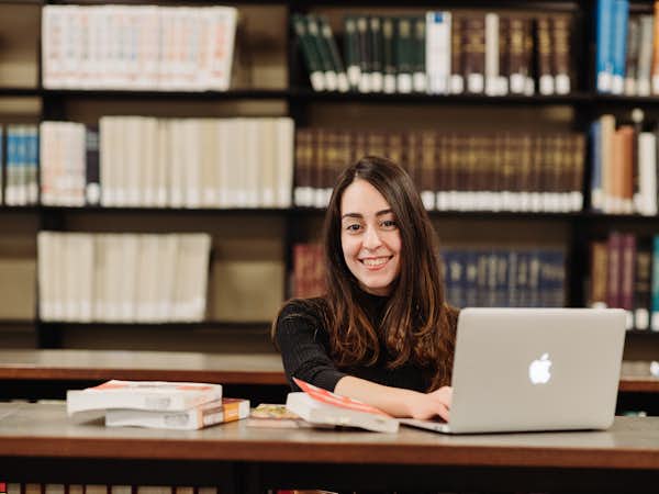 Graduate student working at laptop