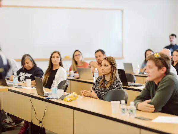 Graduate students sitting in class