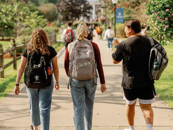 Students walking on campus to chapel.