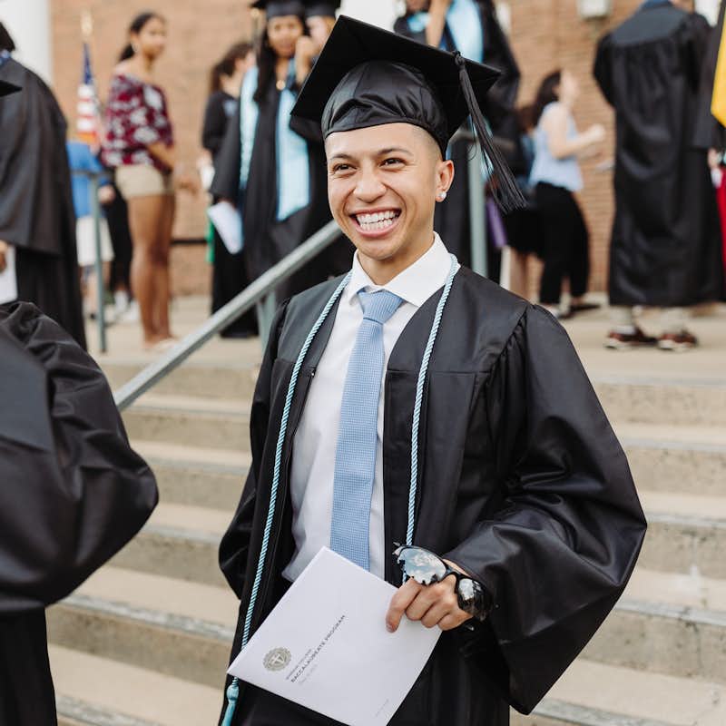 Student smiling at Commencement