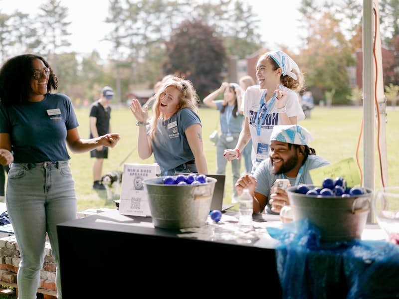 Admissions counselors celebrate outside