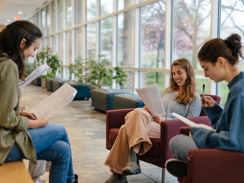 Students read in a circle during a class