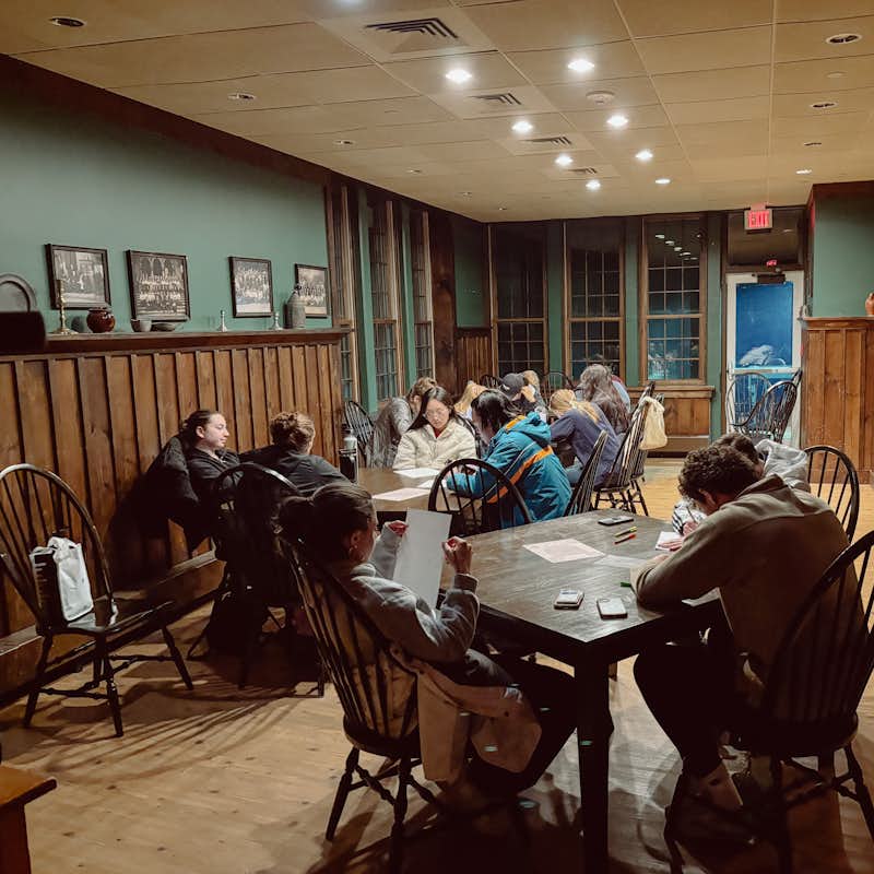 Students at tables praying together