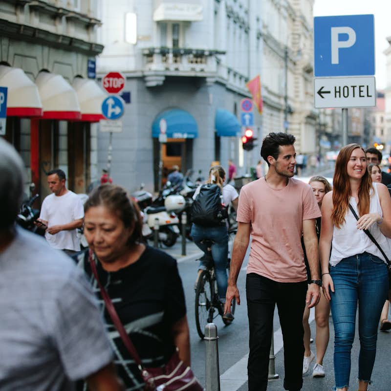 Students of the Balkans semester walk down a city sidewalk