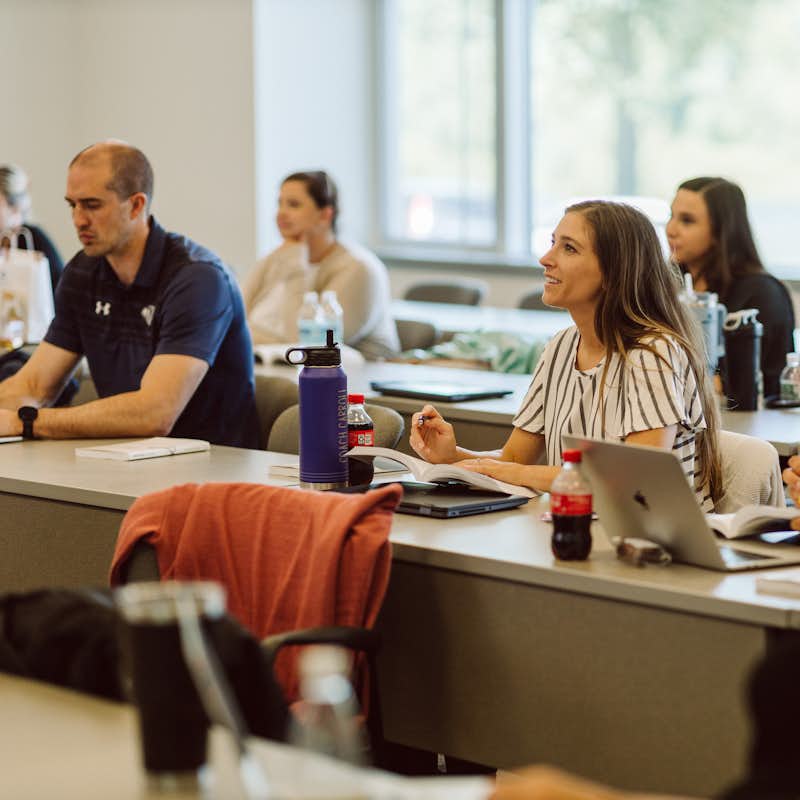 Students of Gordon College's leadership program sit in a classroom with their peers.