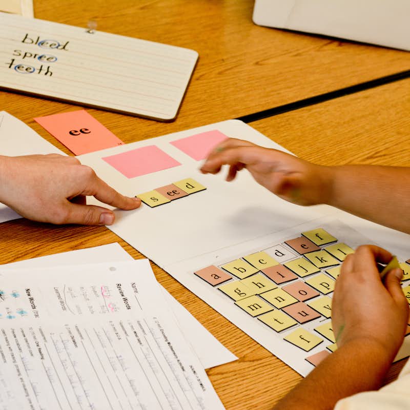 Student learns from a teacher using the Wilson Reading method