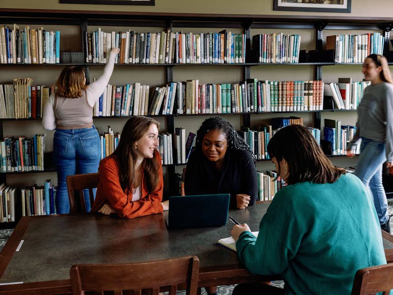 Students studying together in the library.