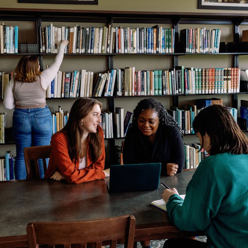 Students studying together in the library.
