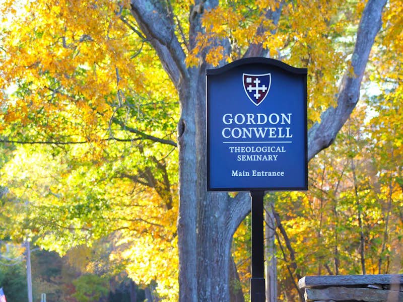 Gordon Conwell Theological Seminary campus sign amidst foliage