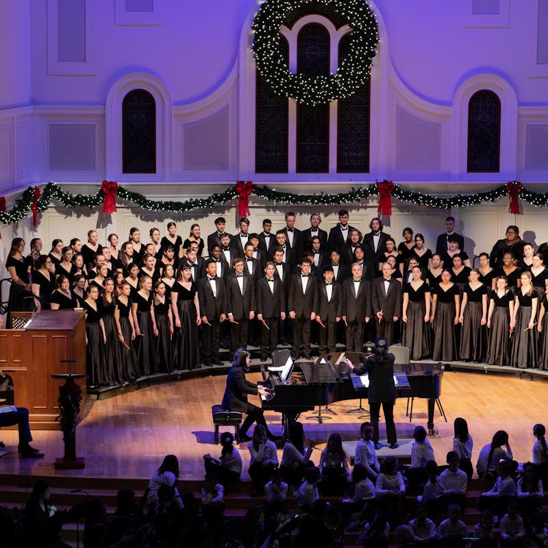 Choir on stage performing as part of the Christmas Gala