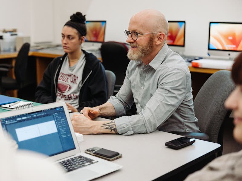 Students and professor in design studio