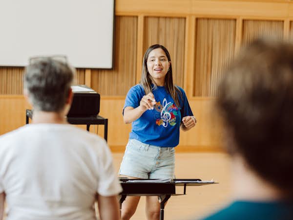 Graduate Music student conducting peers