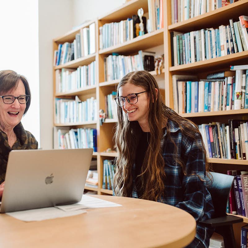Gordon College professor Kaye Cook works one on one with a psychology student.
