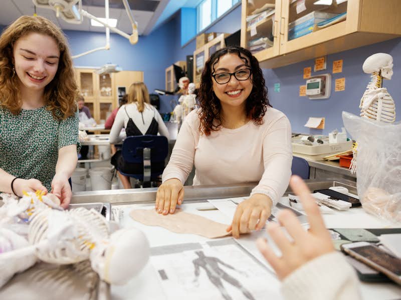 Two students in Human Anatomy lab