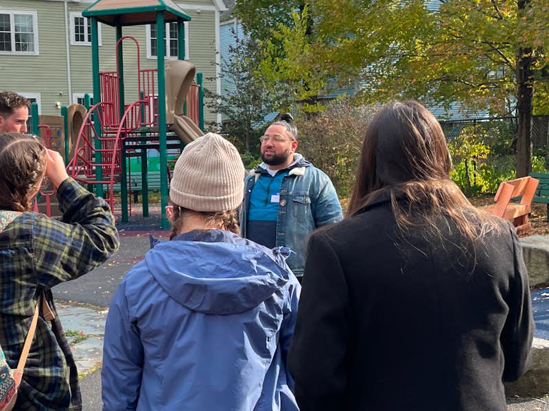 Students listen to a presentation on a field trip