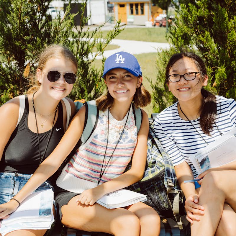 High school students of Gordon College's Heritage program sit in the sun.