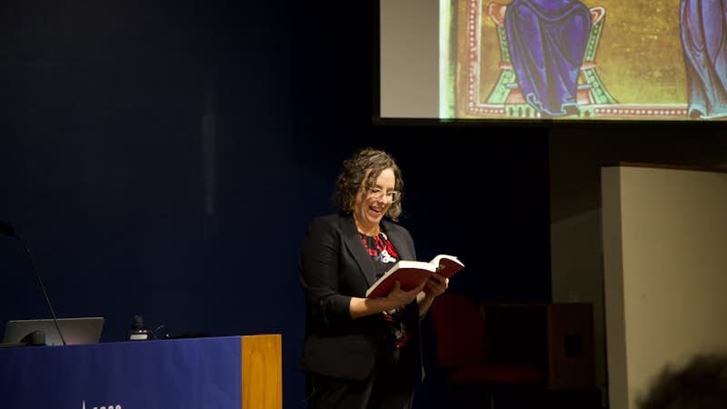 Lauren Whitnah reads to a group of Gordon College students at a Center for Faith and Inquiry event about listening well.